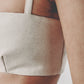 Beige bra crop top styled with the matching low-waist maxi skirt