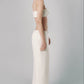 Beige low-rise maxi skirt styled with a matching bra crop top for a two-piece summer outfit