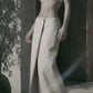 Beige low-rise maxi skirt styled with a matching bra crop top for a two-piece summer outfit