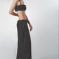 Black bra top styled with the matching low-waist linen maxi skirt