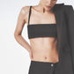 Woman wearing the Black linen bra crop top with matching low-waist maxi skirt