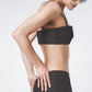 Side profile of the Black linen bra top showing its close structured fit