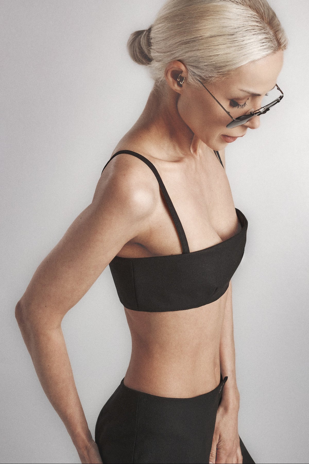 Side view of the Black linen cotton crop top showing its close structured fit
