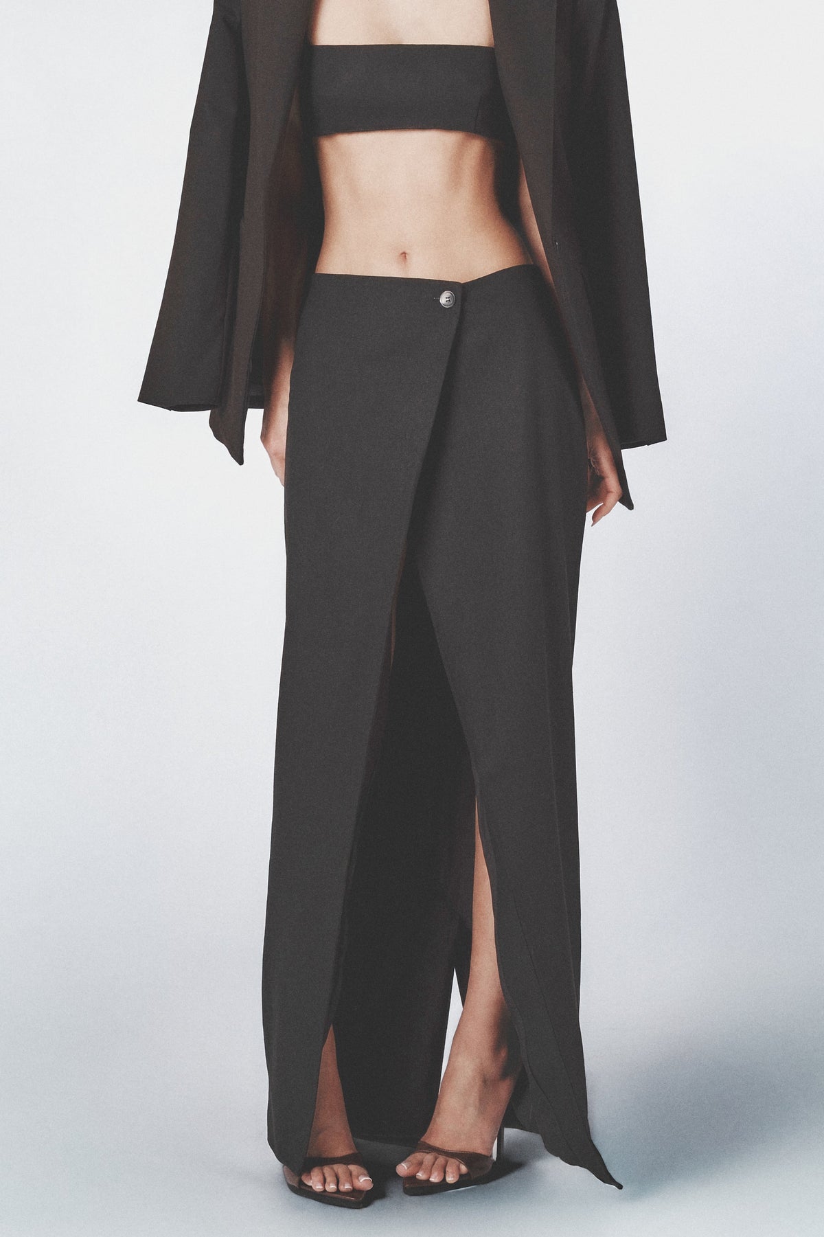 Side profile of the Black linen maxi skirt showing its straight cut