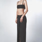 Woman wearing a Black low-rise maxi skirt with a straight full-length cut