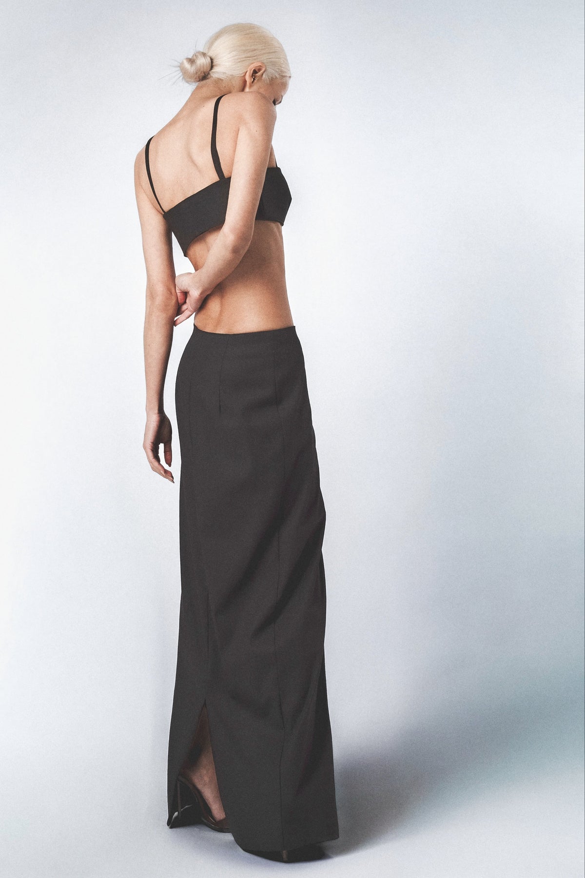 Black maxi skirt styled with the matching Sý Bra Top