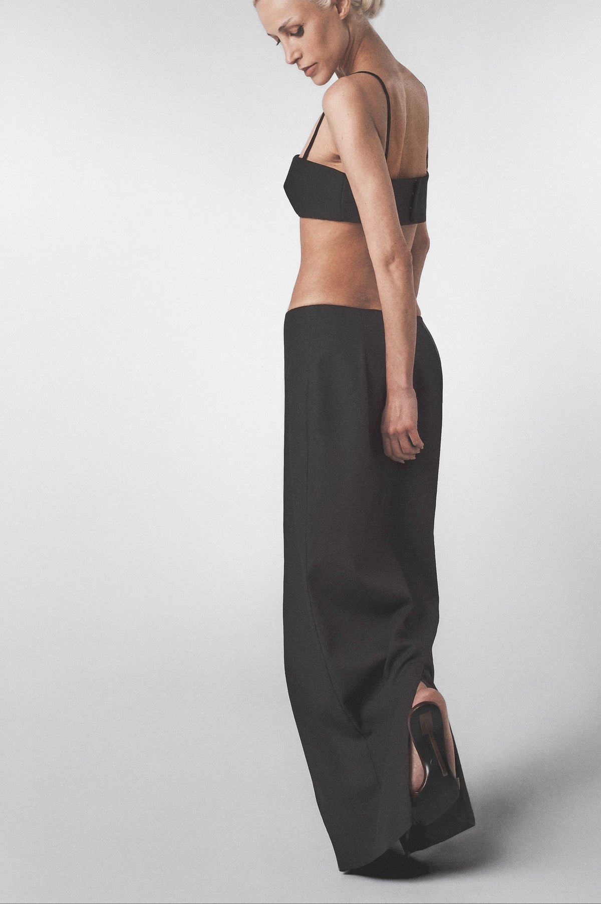 Side view of the Black linen cotton maxi skirt showing the low-waist fit