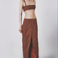 Woman wearing the Cacao brown linen cotton maxi skirt with matching bra crop top