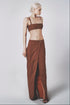 Woman wearing the Cacao brown linen cotton maxi skirt with matching bra crop top
