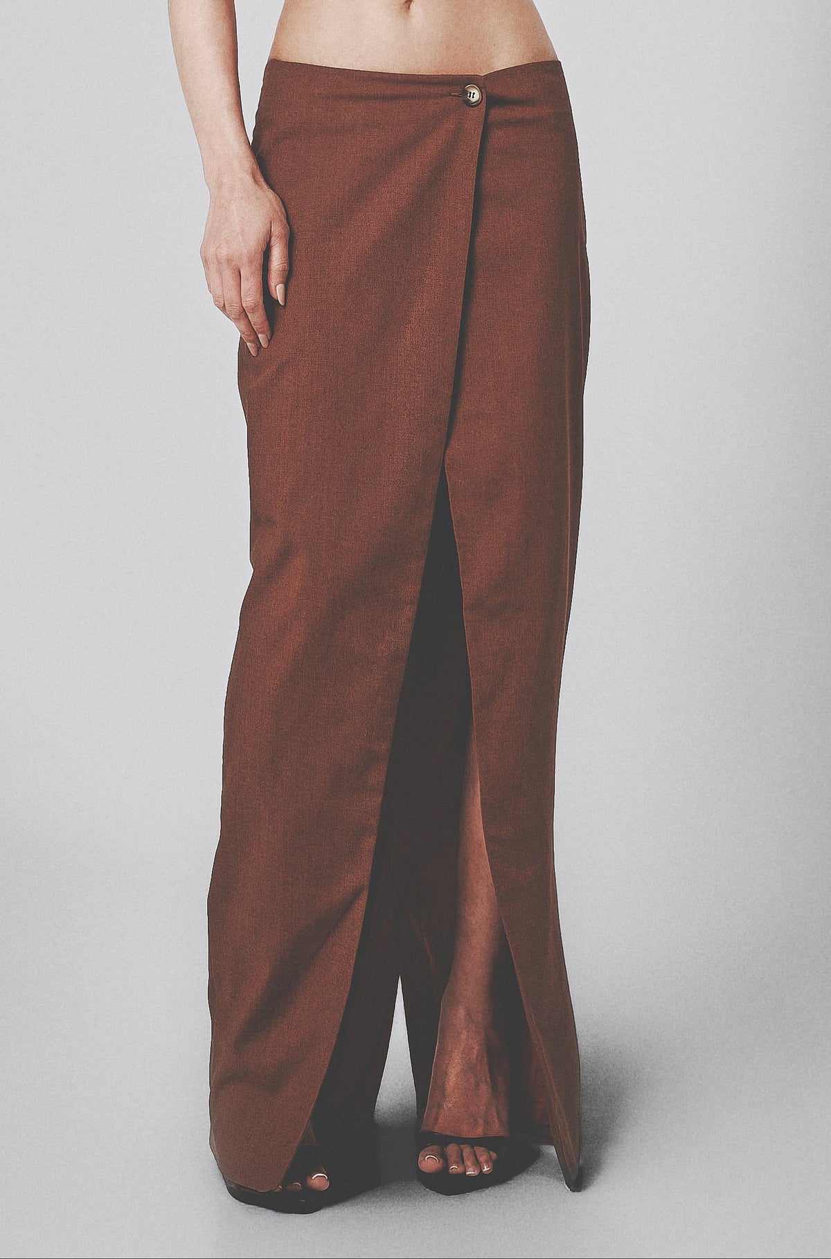 Front view of the Cacao linen cotton maxi skirt showing the low waist and button closure