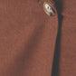 Close-up of the Cacao maxi skirt showing the low waist and front button closure