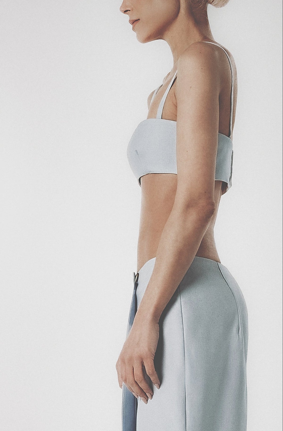 Side profile of a light blue linen cotton maxi skirt with matching crop top