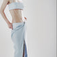 Side profile of a light blue linen cotton maxi skirt with matching crop top