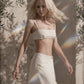Woman wearing a Sand beige bra crop top with matching maxi skirt outdoors