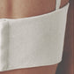 Woman wearing a Sand beige crop top as part of a simple capsule outfit