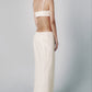 Woman wearing a Sand linen cotton maxi skirt and matching cropped bra top