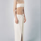 Woman wearing a Sand low-waist linen cotton maxi skirt with matching bra crop top