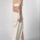 Sand low-waisted maxi skirt paired with a matching cropped top for a women’s summer outfit