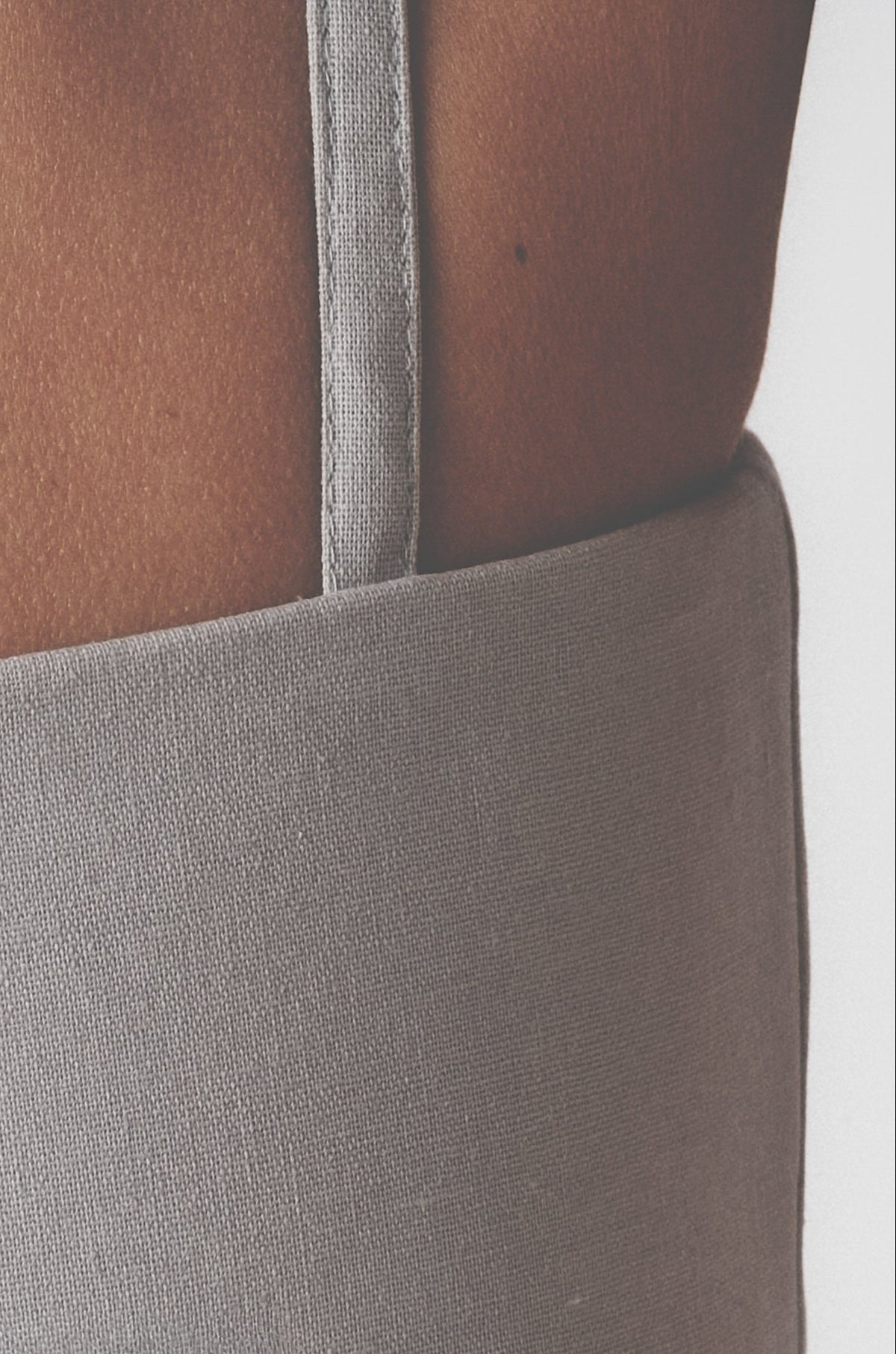 Back detail of the Silver bra top showing the adjustable dual-row hook closure