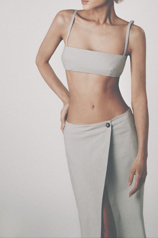 Woman wearing the Silver grey linen bra crop top with matching low-waist maxi skirt