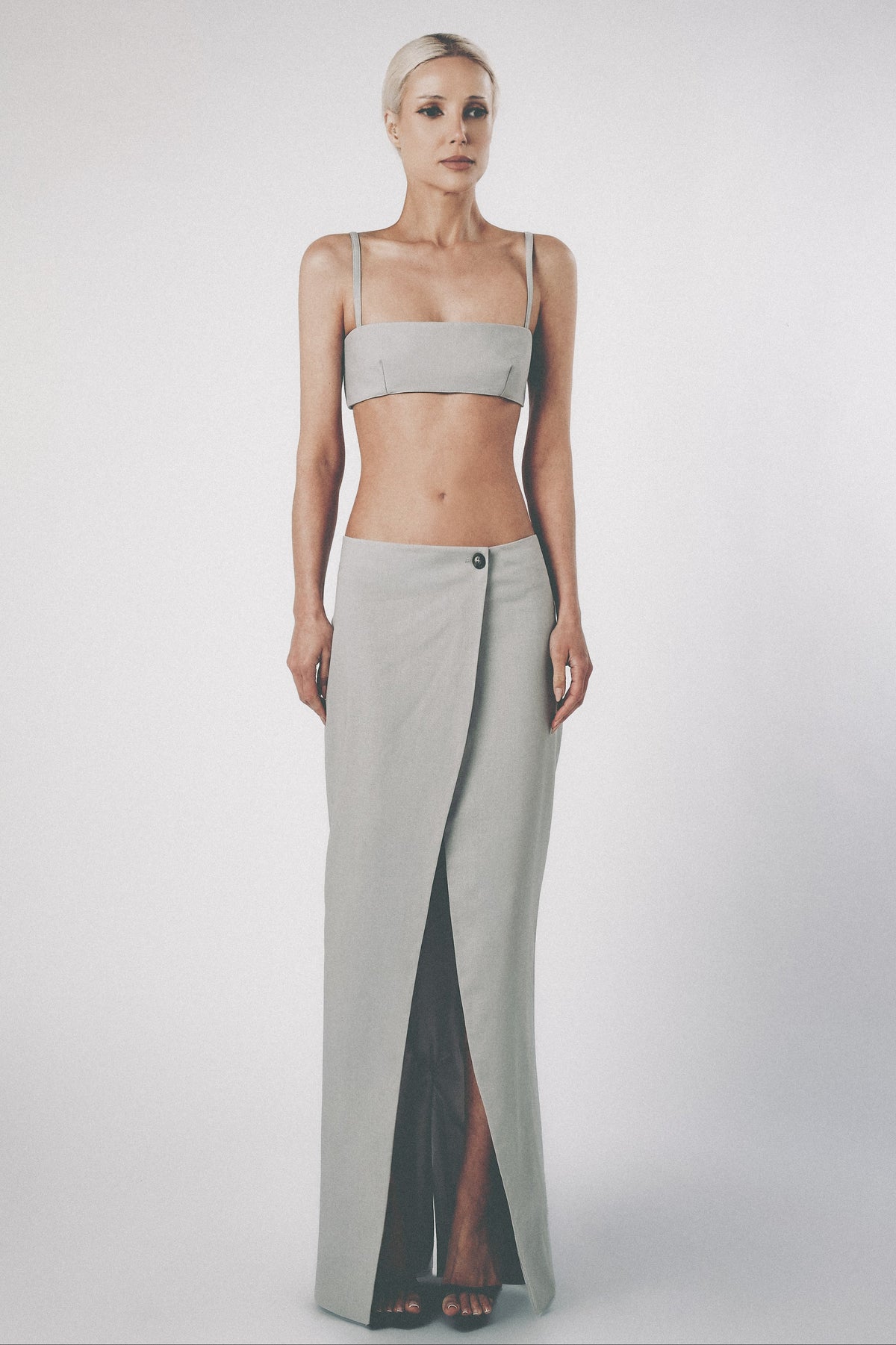 Woman wearing the Silver light grey linen cotton maxi skirt with matching bra crop top