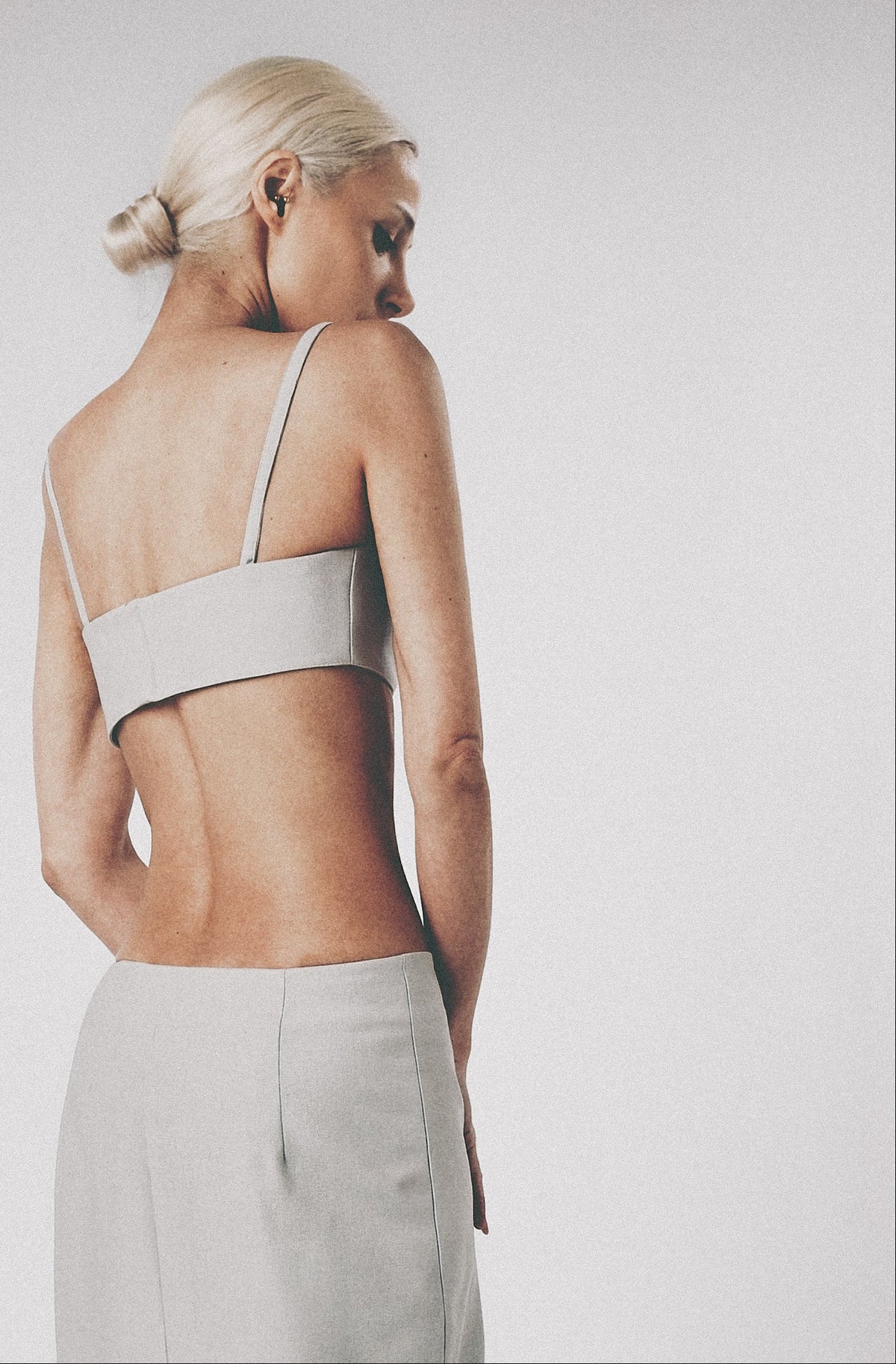 Silver maxi skirt styled with the matching structured bra crop top