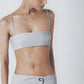 Woman wearing the Sky Blue linen bra crop top with matching low-waist maxi skirt