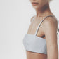 Side view of the Sky Blue linen cotton bra top showing its close structured fit