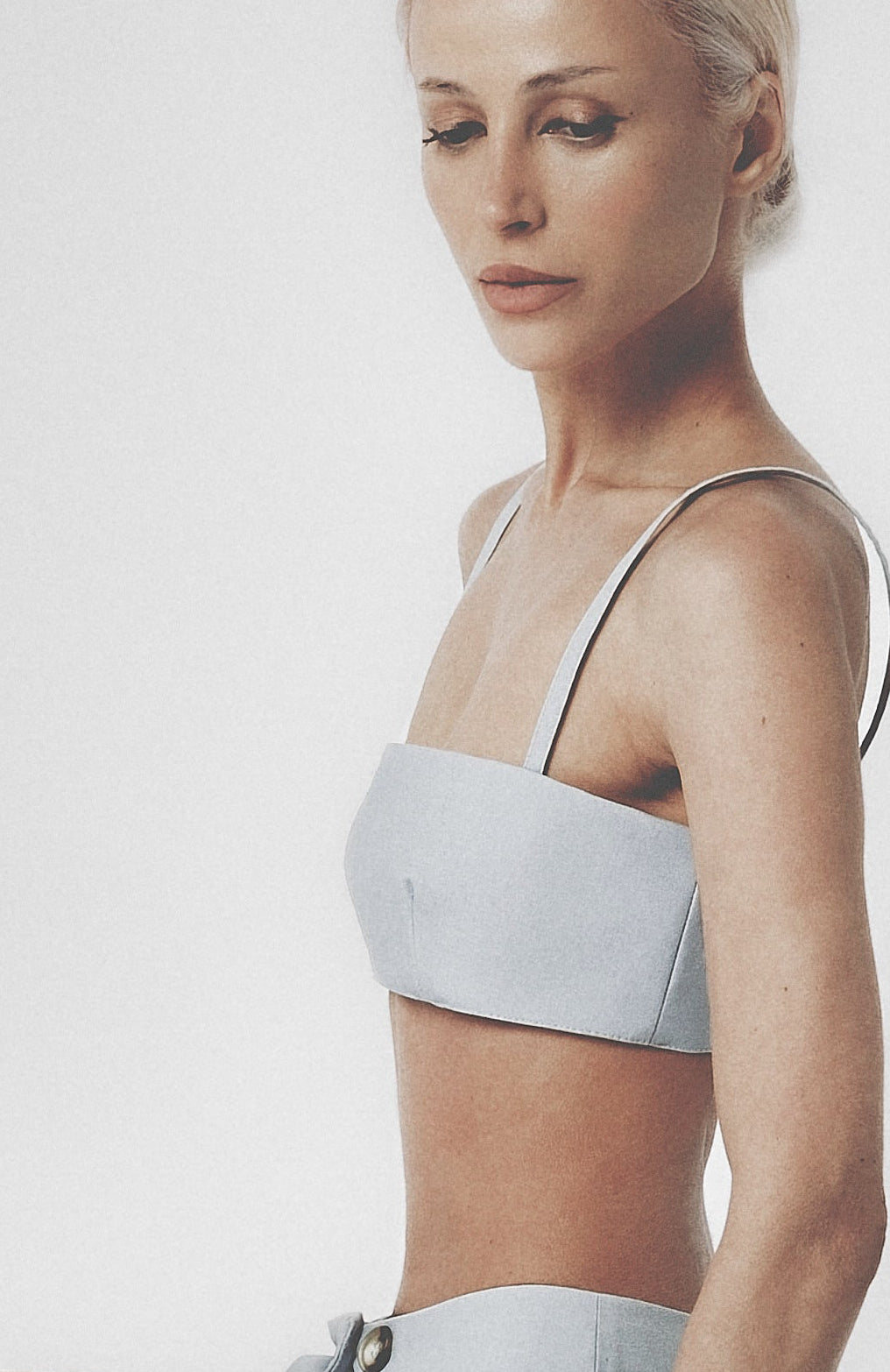Side view of the Sky Blue linen cotton bra top showing its close structured fit