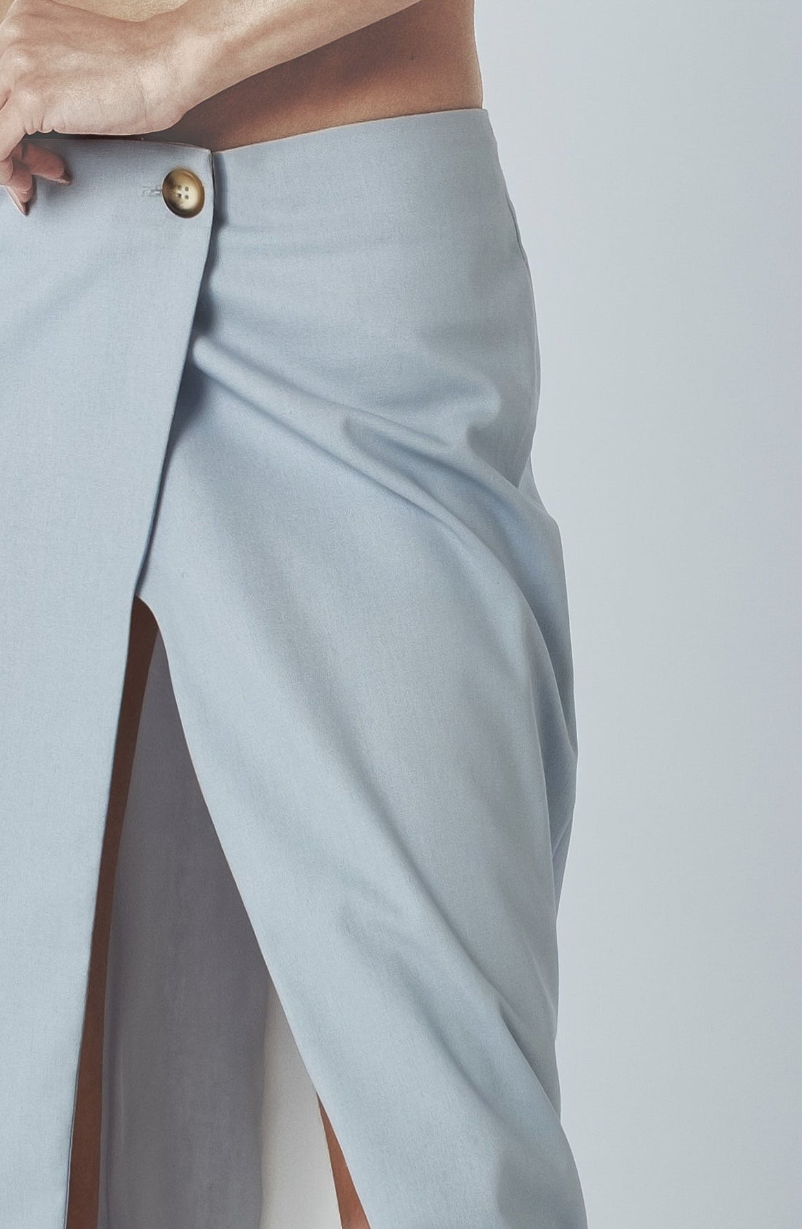 Close-up of the Sky Blue maxi skirt showing the low waist and front closure