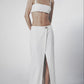 Woman wearing a White linen cotton maxi skirt with matching crop top