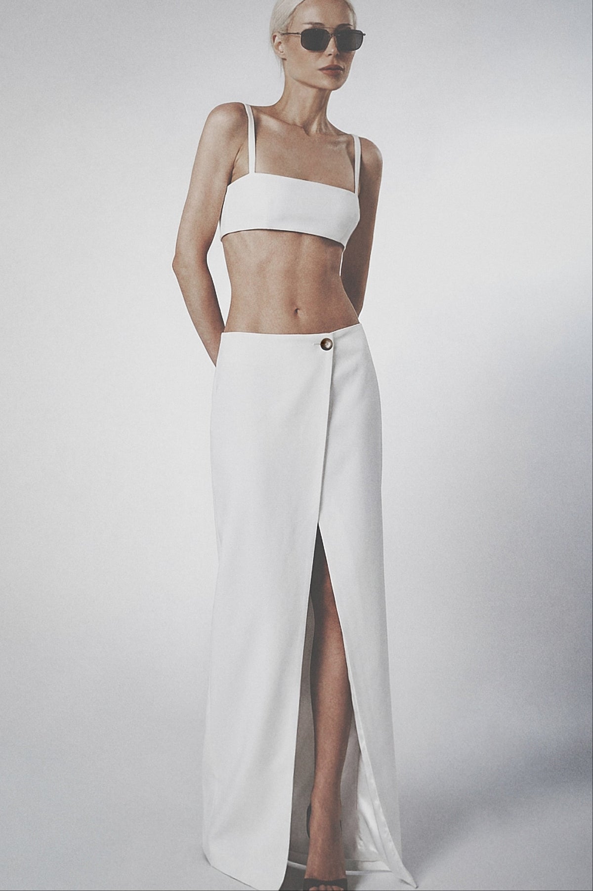 Woman wearing a White linen cotton maxi skirt with matching crop top