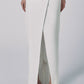 Front view of the White low-waist linen cotton maxi skirt with button closure