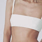 Woman wearing the White structured linen crop top with matching maxi skirt