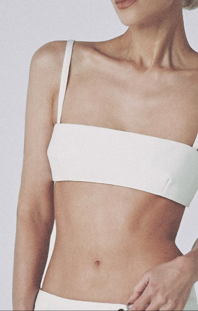 Woman wearing the White structured linen crop top with matching maxi skirt